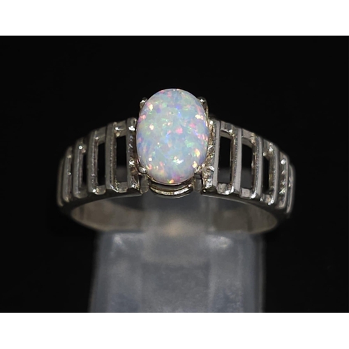 1666 - A 925 Silver Opal Ring. Total Weight 2.33g. Size Q/R