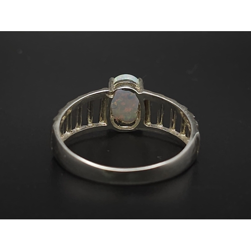 1666 - A 925 Silver Opal Ring. Total Weight 2.33g. Size Q/R