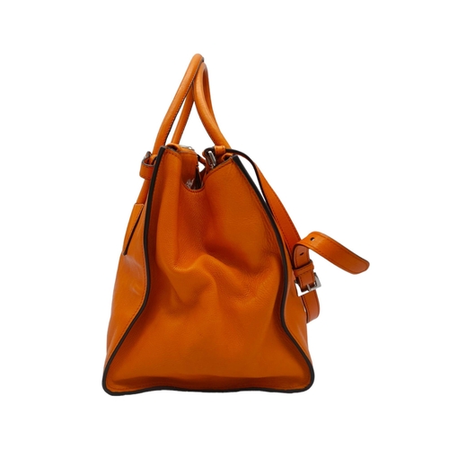 192 - A Prada Saffiano Double Zip Luxury Tote Bag. Burnt orange leather with silver tone hardware. Spaciou... 