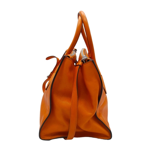 192 - A Prada Saffiano Double Zip Luxury Tote Bag. Burnt orange leather with silver tone hardware. Spaciou... 