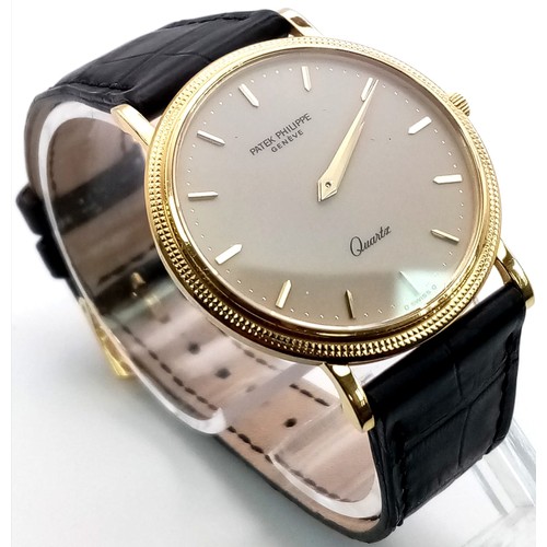 206 - A PATEK PHILIPPE 18K GOLD GENTS QUARTZ WATCH ON ORIGINAL LEATHER STRAP AND BEAUTIFULLY DECORATED BEZ... 