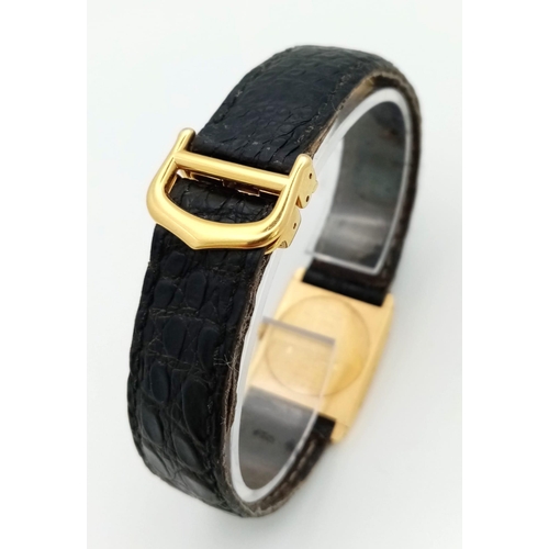 127 - A Vintage Cartier 18k Gold Unisex Tank Watch. Black leather strap. 18K gold case - 23mm width. White... 