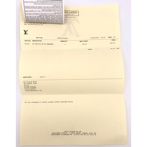 185 - A Louis Vuitton Burgundy Patent Leather Bag. Monogram exterior with gilded handle. Textile interior ... 