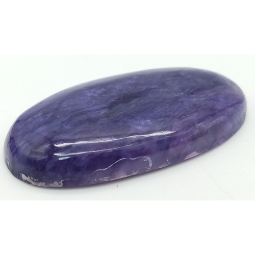 126 - A rare and beautiful, high quality, large (50 carats), natural CHAROITE. Highly polished, oval caboc... 