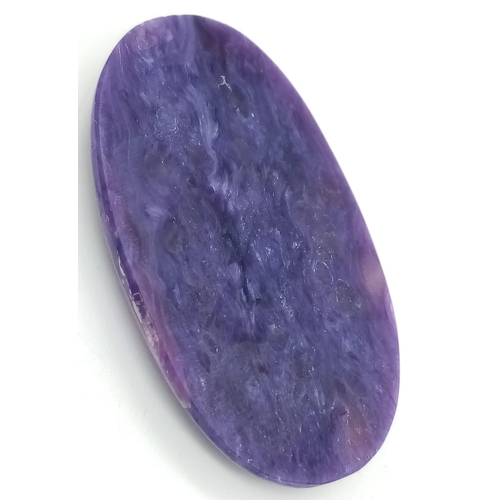 126 - A rare and beautiful, high quality, large (50 carats), natural CHAROITE. Highly polished, oval caboc... 