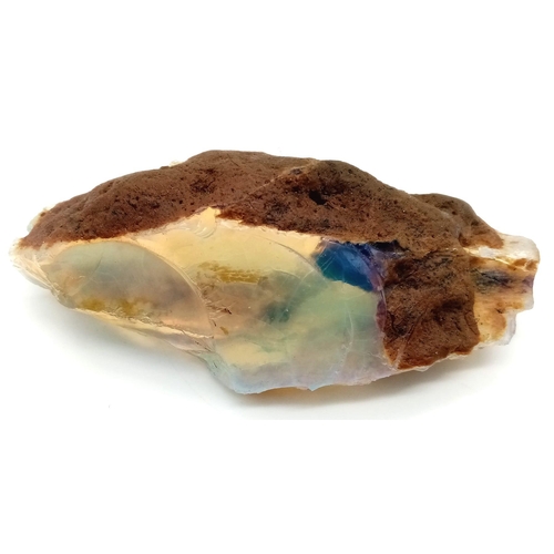 140 - A large (429.20 carats!), natural, rough opal, with mainly blue, green and yellow hues, semi-translu... 