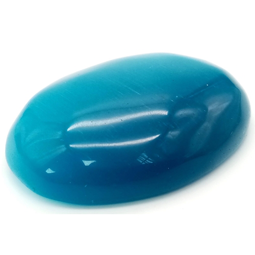 154 - An amazing, huge (263 carats), blue CAT’S EYE (variety of Chrysoberyl). Oval cabochon, lab created, ... 