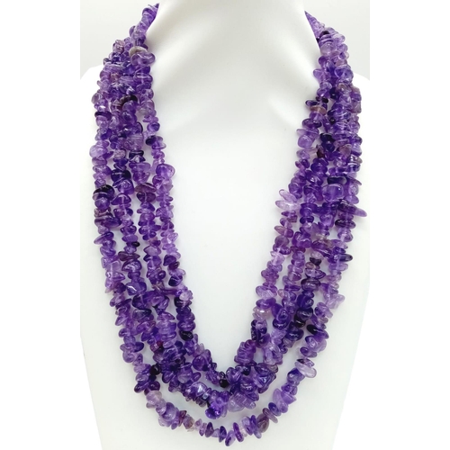 203 - A four strand amethyst necklace. Stones with good vivid colouration. Length: 47-54 cm, weight: 142 g... 