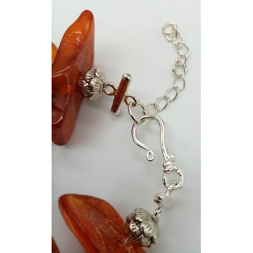 210 - An interesting Tibetan silver and Baltic amber natural bracelet. Length: 19-22 cm, weight: 56 g