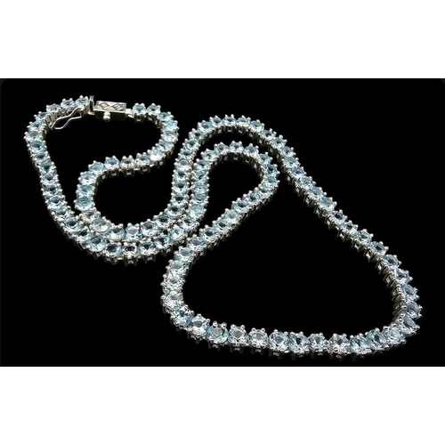 405 - A Blue Topaz Gemstone Tennis Necklace set in 925 Silver. 46cm. 33g total weight.