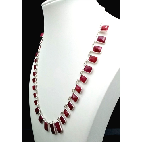 440 - A Graduating Ruby Gemstone Chain Necklace set in 925 Silver. 43cm. 22g total weight.