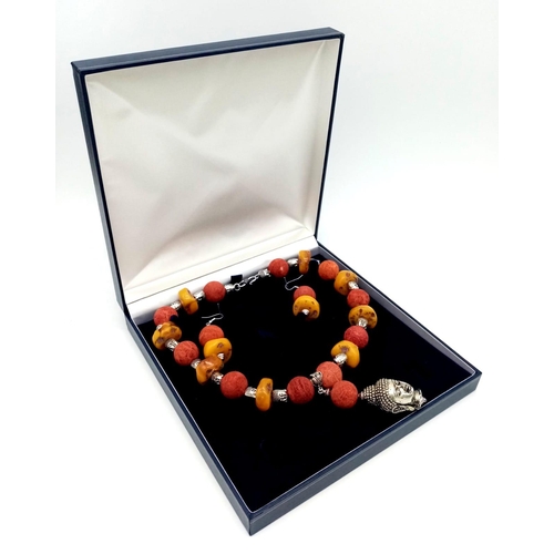 105 - A substantial, Tibetan silver, Buddhist, butterscotch amber and red coral necklace and earrings set ... 