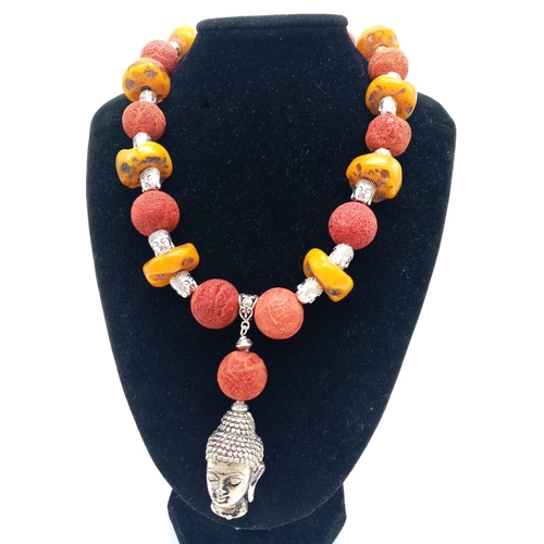 105 - A substantial, Tibetan silver, Buddhist, butterscotch amber and red coral necklace and earrings set ... 