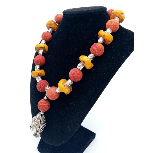 105 - A substantial, Tibetan silver, Buddhist, butterscotch amber and red coral necklace and earrings set ... 