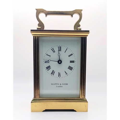 374 - A Vintage Mappin and Webb Carriage Clock. In working order with key. 11cm tall.