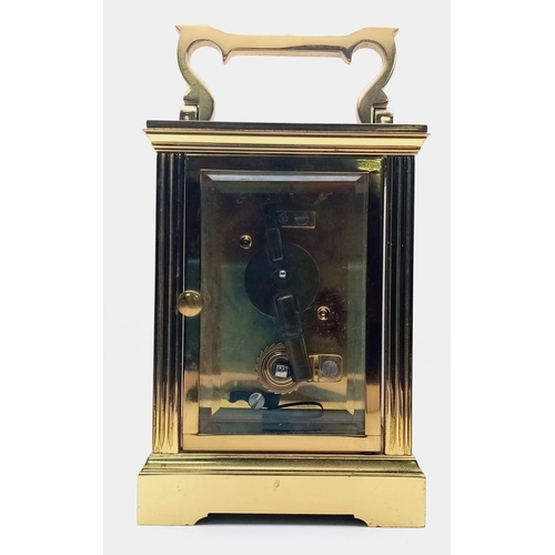 374 - A Vintage Mappin and Webb Carriage Clock. In working order with key. 11cm tall.