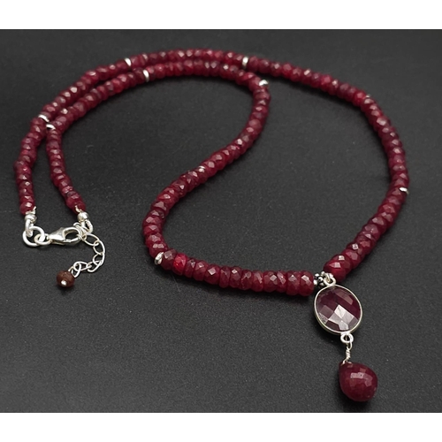 433 - A 120ct Ruby Bead Gemstone Necklace with a Ruby Drop Pendant. 3/4mm beads. 3cm and 42cm.