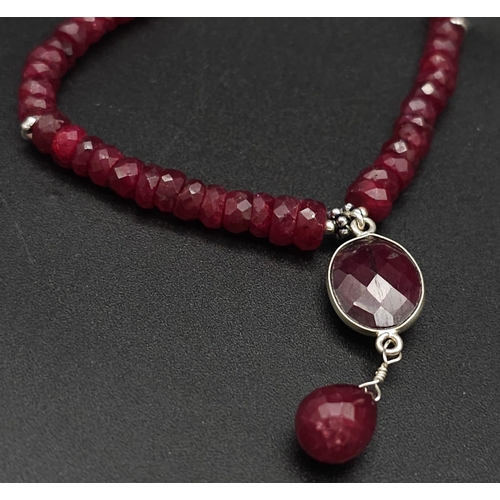 433 - A 120ct Ruby Bead Gemstone Necklace with a Ruby Drop Pendant. 3/4mm beads. 3cm and 42cm.