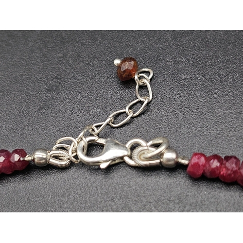 433 - A 120ct Ruby Bead Gemstone Necklace with a Ruby Drop Pendant. 3/4mm beads. 3cm and 42cm.