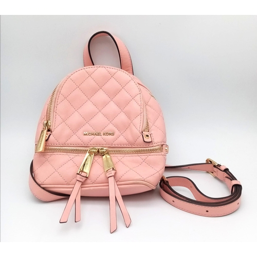 295 - A Pink Michael Kors Mini Rhea Zip Quilted Leather Backpack With A Convertible Strap. See Photos for ... 