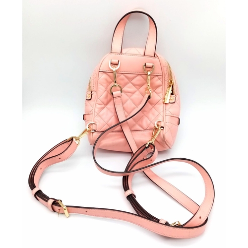 295 - A Pink Michael Kors Mini Rhea Zip Quilted Leather Backpack With A Convertible Strap. See Photos for ... 