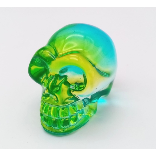 422 - A Turquiose Titanium Covered Hand Carved Quartz Skull Figure or Paperweight. 5cm x 4cm.