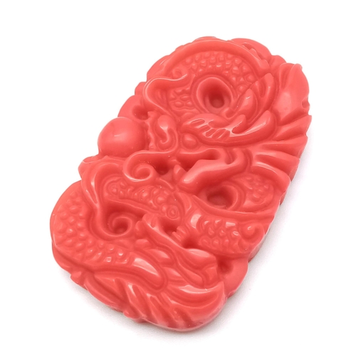 465 - A Red Jade Decorative Dragon Pendant. 5cm x 3cm