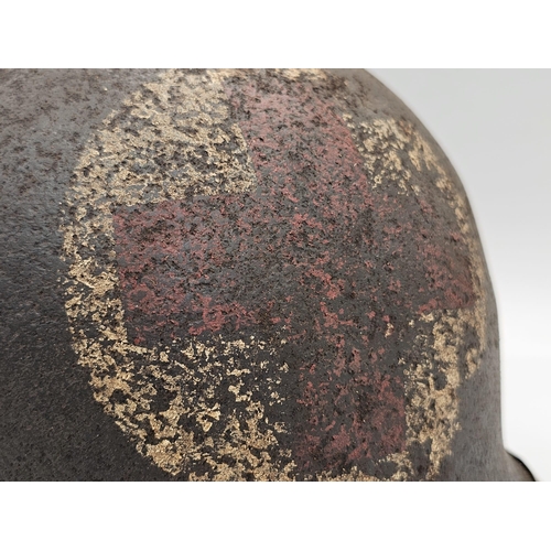 237 - Semi Relic WW2 US Rangers Medic’s M1 Helmet. Early War fixed Bale with front split seam.