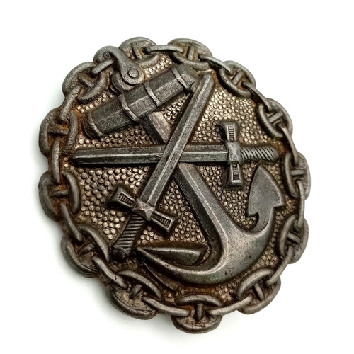 328 - WW1 Imperial German Navy (Kaiserliche Marine) wound badge and lapel pin. A silver grade example depi... 