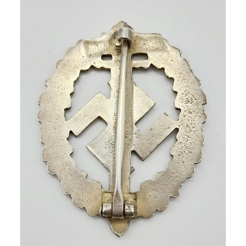 349 - WW2 German SA Disabled Veterans Sports Badge. A silver grade example depicting a Roman broad sword, ... 