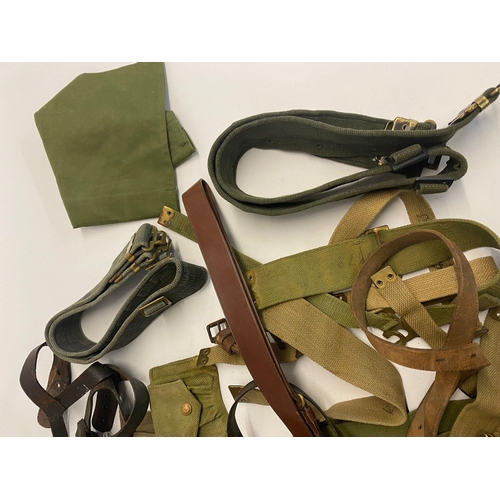 494 - Assorted lot of ww2 British militaria which includes ammo pouches, putties, gators, belts and more. ... 