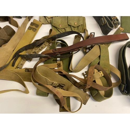 494 - Assorted lot of ww2 British militaria which includes ammo pouches, putties, gators, belts and more. ... 