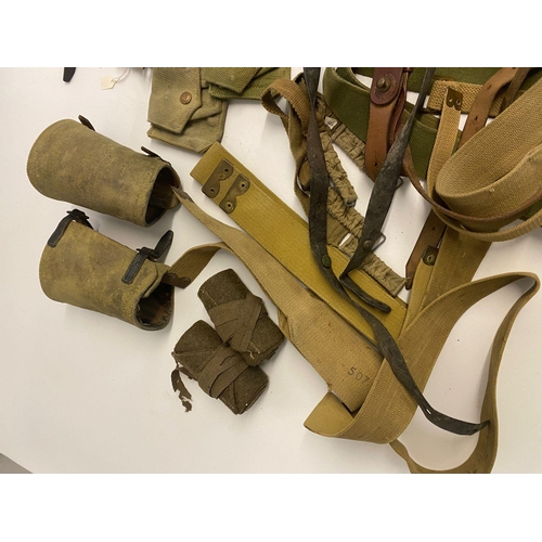 494 - Assorted lot of ww2 British militaria which includes ammo pouches, putties, gators, belts and more. ... 