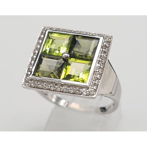 710 - An Unworn Limited Edition (1 of 100) Sterling Silver Moldavite, Peridot & White Topaz Set Ring, Size... 