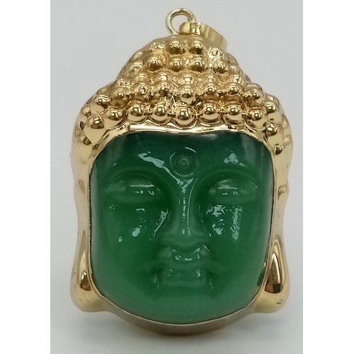 457 - A Gold Tone Jade Buddha Pendant. Total Weight 19.53g