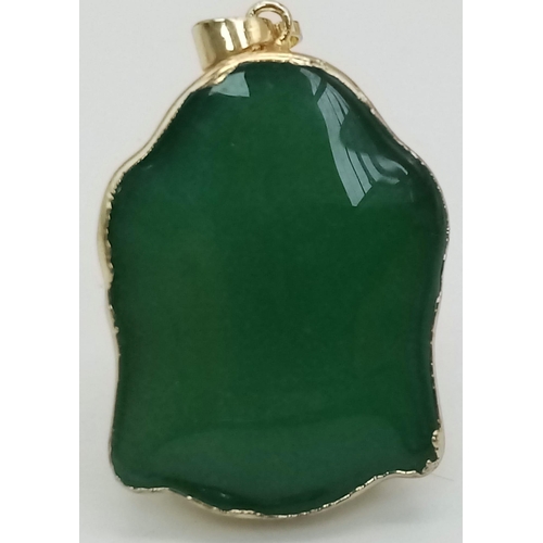 457 - A Gold Tone Jade Buddha Pendant. Total Weight 19.53g