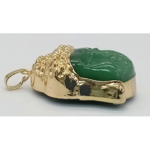 457 - A Gold Tone Jade Buddha Pendant. Total Weight 19.53g