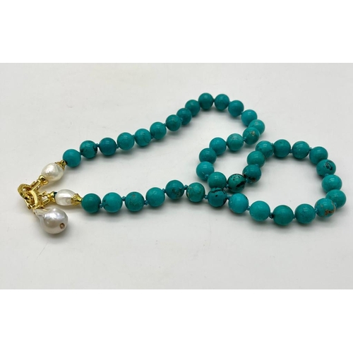 352 - An Exquisite Blue Turquoise and Baroque Pearl Necklace. 10mm turquoise beads lead to a Baroque Drop!... 