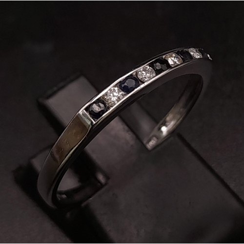 354 - A 9K White Gold Sapphire and Diamond Half Eternity Ring. Size Q. 1.55g total weight.