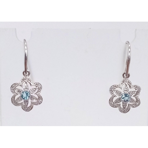 375 - A Pair of 18K White Gold, Aquamarine and Diamond Floral Earrings. 2.6g total weight.