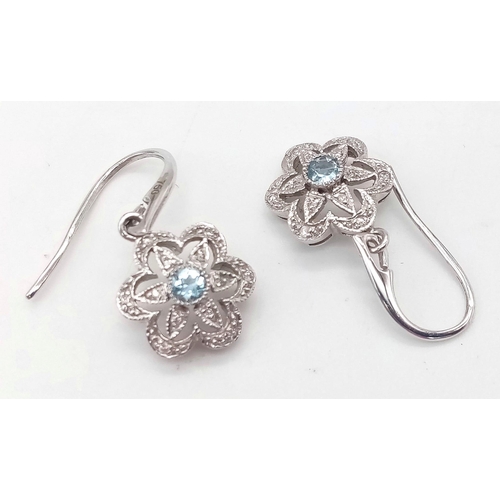 375 - A Pair of 18K White Gold, Aquamarine and Diamond Floral Earrings. 2.6g total weight.