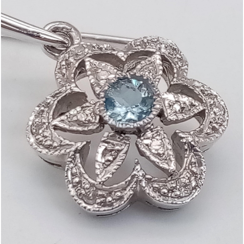 375 - A Pair of 18K White Gold, Aquamarine and Diamond Floral Earrings. 2.6g total weight.