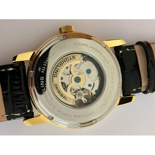 28 - Gentlemans AUTOMATIC SKELETON WRISTWATCH from MAX STUHRLING of NEW YORK. Finished in gold tone and h... 