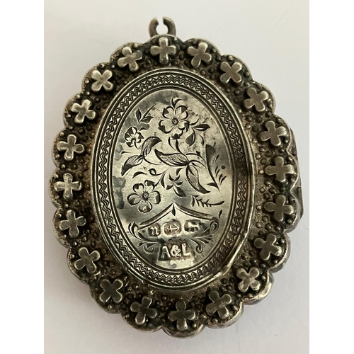 343 - Antique VICTORIAN SILVER MOURNING LOCKET having raised decoration and detail to both sides. Clear ha... 