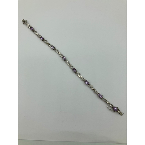 546 - Fabulous SILVER and AMETHYST TENNIS BRACELET consisting eight oval cut individually mounted Amethyst... 