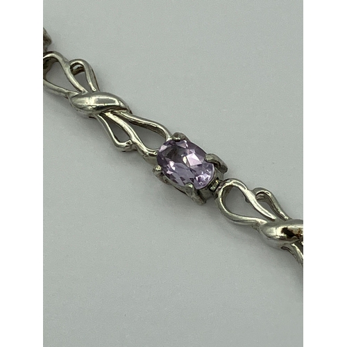 546 - Fabulous SILVER and AMETHYST TENNIS BRACELET consisting eight oval cut individually mounted Amethyst... 