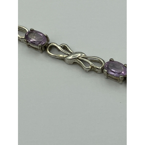 546 - Fabulous SILVER and AMETHYST TENNIS BRACELET consisting eight oval cut individually mounted Amethyst... 