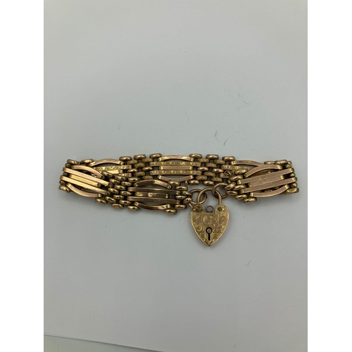 63 - Vintage 9 carat ROSE GOLD GATE BRACELET with beautifully engraved heart padlock fastening. 13.84 gra... 