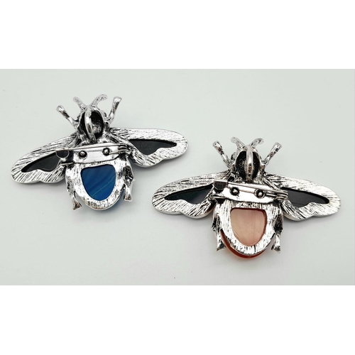 394 - Two Gemstone Bee Brooches - Lapis and Carnelian. Decorative shell Wings. 5.5cm wingspan. Set in whit... 