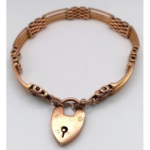 115 - AN ANTIQUE ROSE GOLD GATE BRACELET IN 9K GOLD WITH HEART PADLOCK .   17.6gms